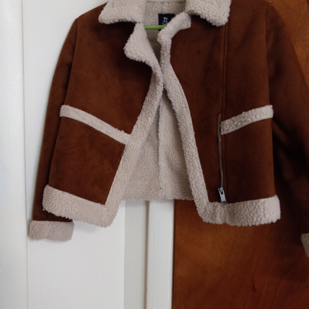 Never worn polyester waist length girl  jacket size 7/8